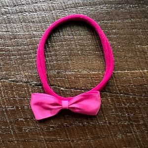 Newborn stretchy headband with pink satin bow